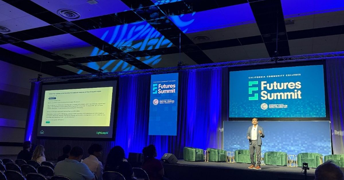 Kiran Kodithala on stage at the California Community Colleges' Futures Summit 2026, with the Futures Summit + CCC Digital Center banners behind him and a Meridian screen on the projector — captioned 'How to build your first AI product.'